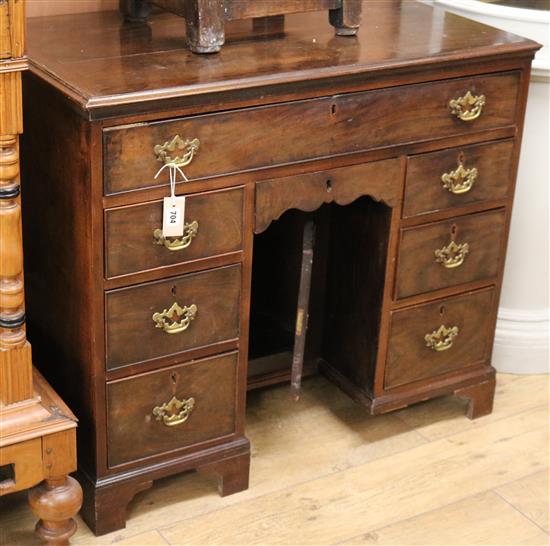A George III mahogany kneehole desk (a.f.) W.95cm
